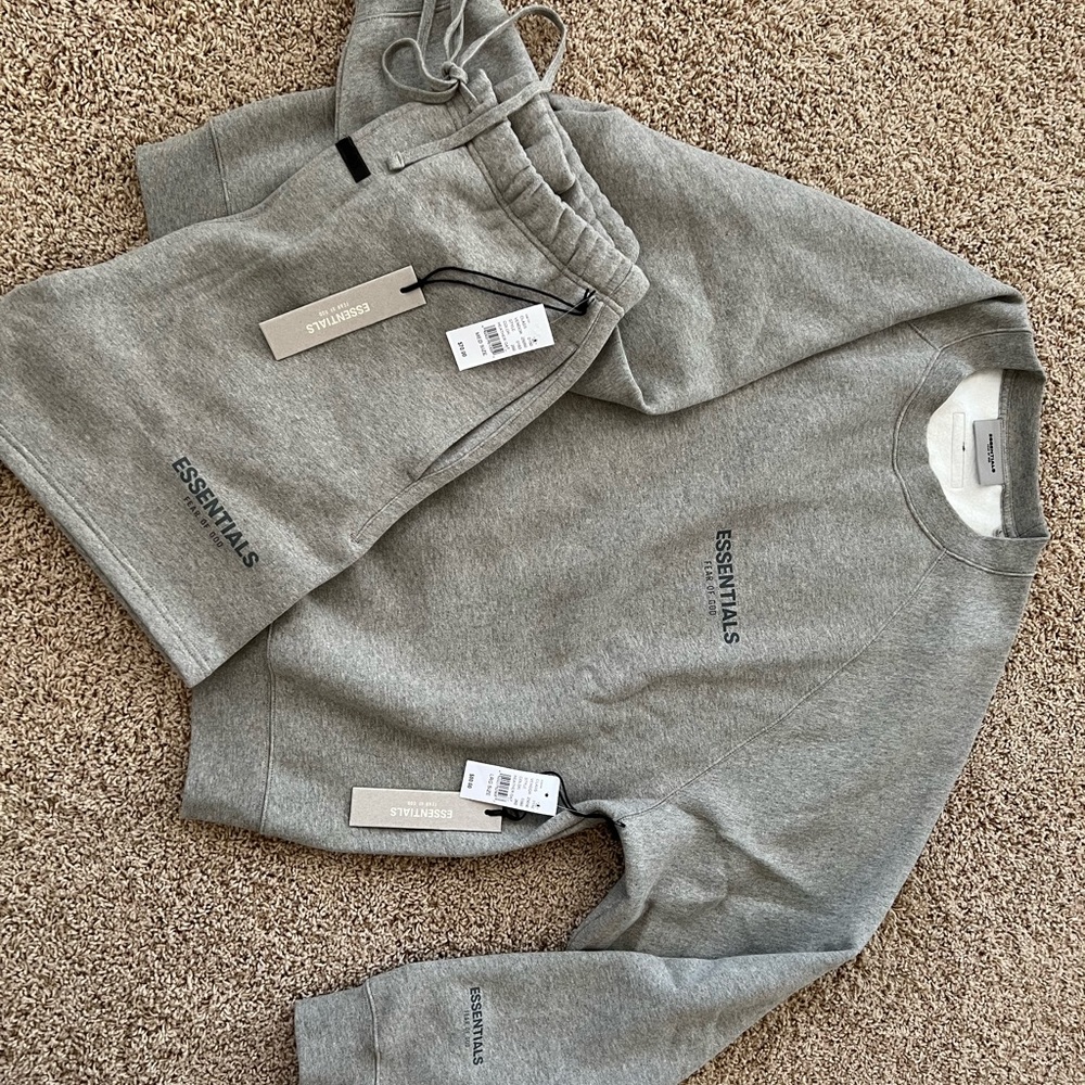 FEAR OF GOD ESSENTIALS. Large Crew Neck and Medium Shorts in color Heather Oat